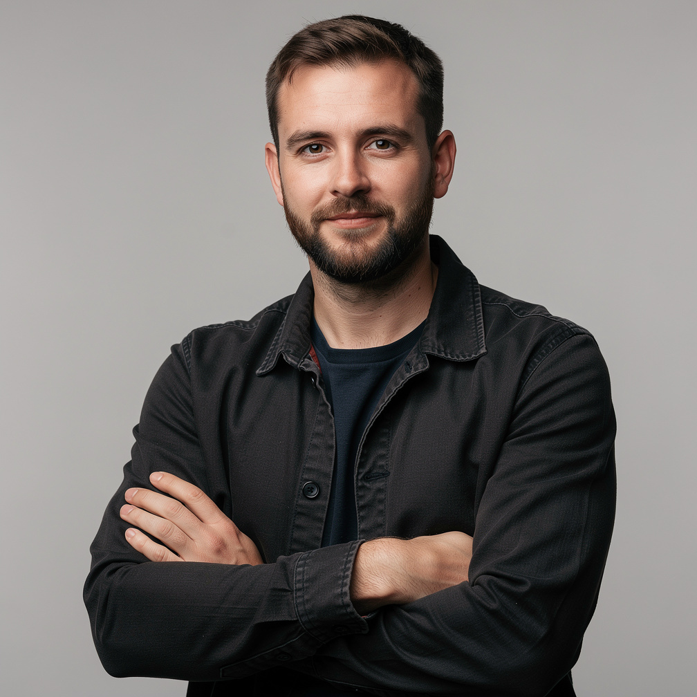 Studio portrait of a young man, camera operator